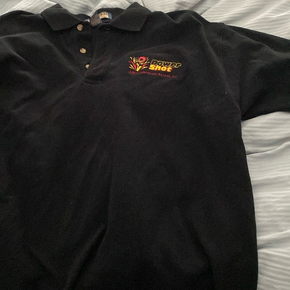 Black polo from Harvard Square on Egyptian cotton with a logo from PowerShot